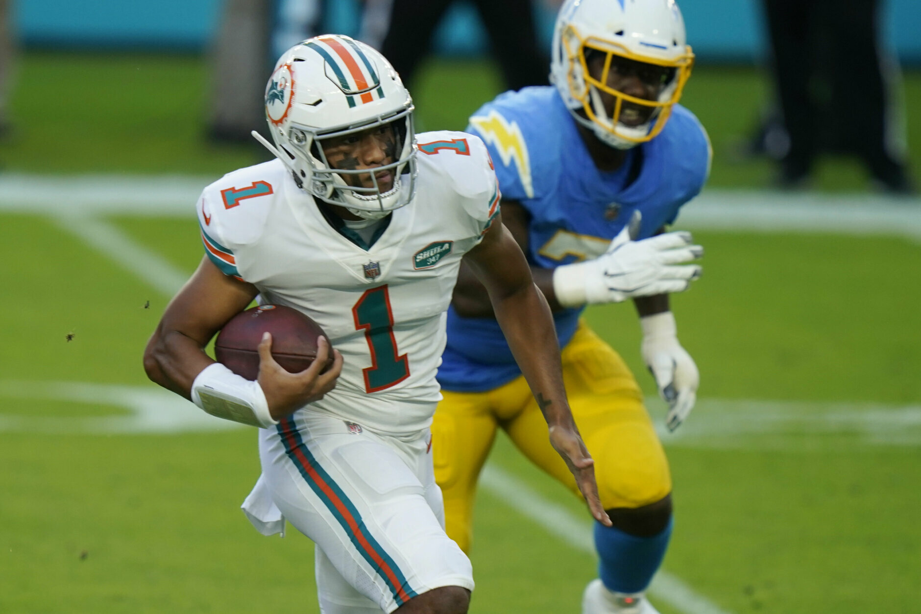 <p><b><i>Chargers 21</i></b><br />
<b><i>Dolphins 29</i></b></p>
<p>First, count me among those who want to see <a href="https://profootballtalk.nbcsports.com/2020/11/13/dolphins-throwbacks-could-eventually-become-their-permanent-uniforms/">Miami make the throwback uniforms the everyday unis</a>. Clean, classic, beautiful — just like the Dolphins sitting at 6-3 and off to their best start in 19 years.</p>
<p>Even as the Chargers are <a href="https://www.latimes.com/sports/chargers/story/2020-11-09/chargers-anthony-lynn">losing in every way possible</a>, they won big by drafting Justin Herbert, the first QB in NFL history to throw multiple touchdowns in six straight games. He and Tua Tagovailoa, whose five touchdowns are the third-most by a quarterback without an interception in his first three starts, seem <a href="https://www.youtube.com/watch?v=3dtFIjaD5hA" target="_blank" rel="noopener">destined to do this forever</a>.</p>
