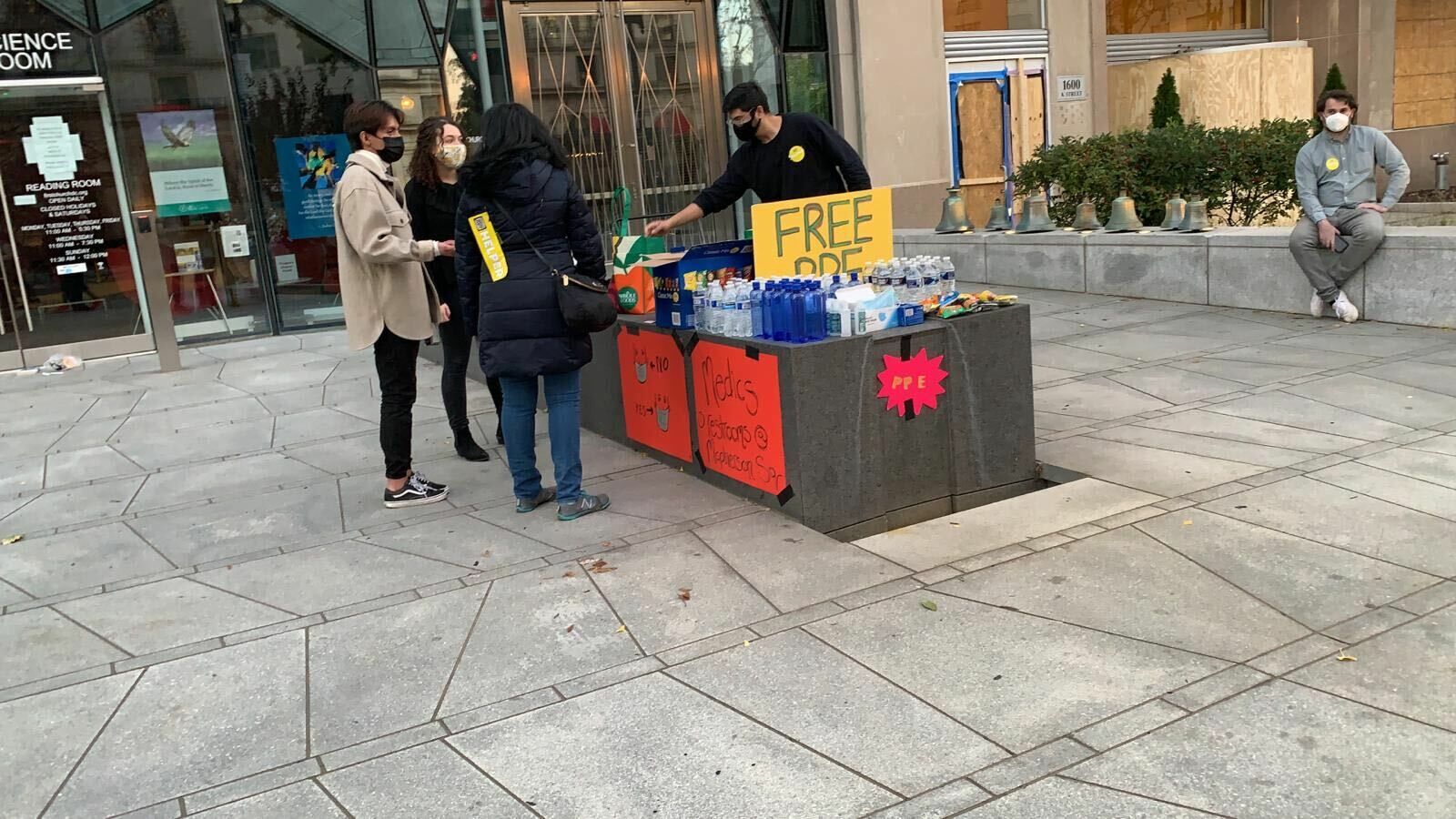 <p>Stations have been set up to hand out water and snacks to protesters in Black Lives Matter Plaza on Election Day.</p>

