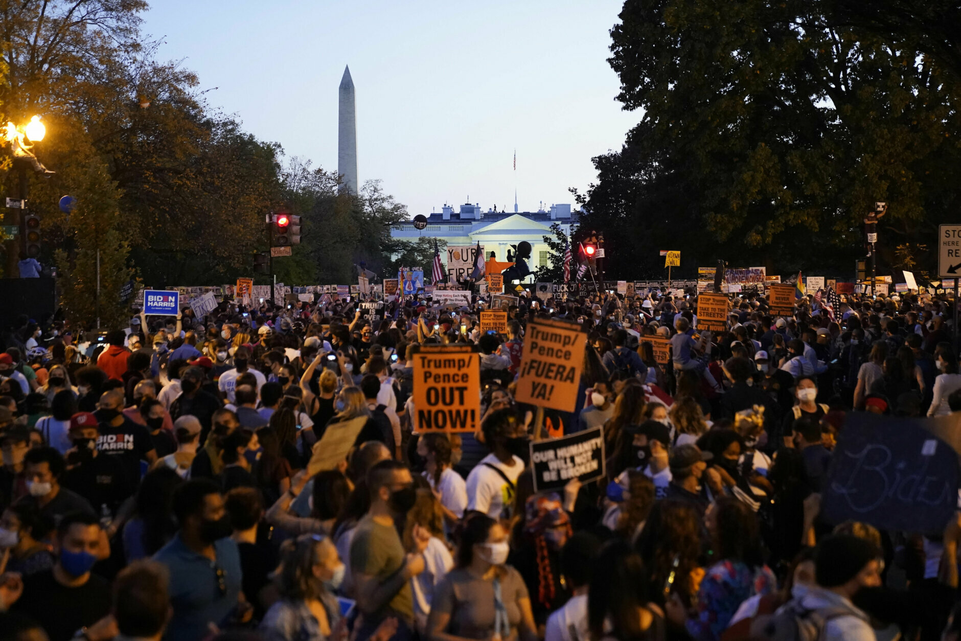 People celebrate in the streets outside the White House.