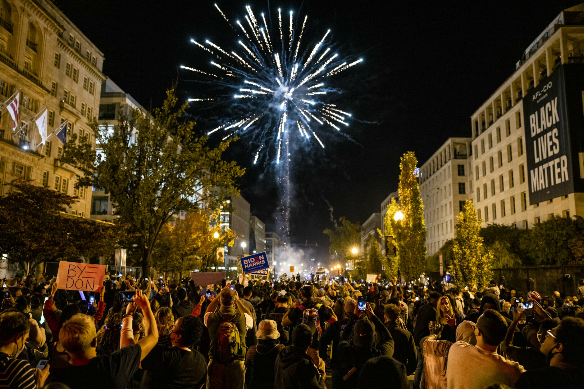 WASHINGTON, DC - NOVEMBER 07: Fireworks explode above Black Lives Matter Plaza near the White House as thousands wait to hear President-elect Joe Biden and Vice President-elect Kamala Harris speak from Delaware on November 7, 2020 in Washington, DC. News outlets announced today that Joe Biden had reached the number of electoral votes needed to win the election and become the 46th president of the United States. (Photo by Samuel Corum/Getty Images)