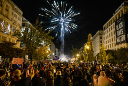 WASHINGTON, DC - NOVEMBER 07: Fireworks explode above Black Lives Matter Plaza near the White House as thousands wait to hear President-elect Joe Biden and Vice President-elect Kamala Harris speak from Delaware on November 7, 2020 in Washington, DC. News outlets announced today that Joe Biden had reached the number of electoral votes needed to win the election and become the 46th president of the United States. (Photo by Samuel Corum/Getty Images)