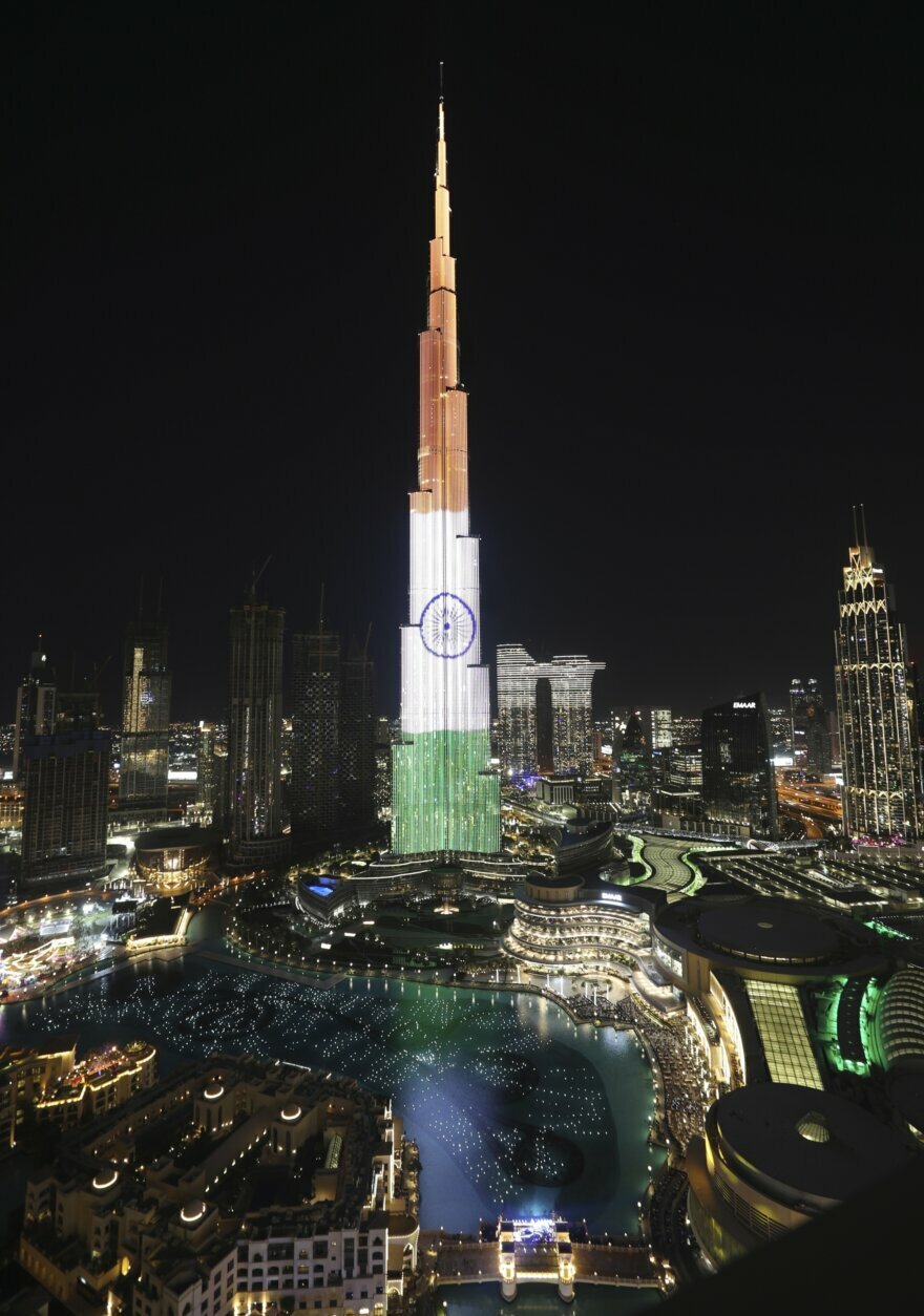 Dubai celebrates the new year in India by reflecting their national flag on the Burj Khalifa, the world's tallest building, to mark New Year in Dubai, United Arab Emirates, Friday, Jan. 1, 2021. (AP Photo/Kamran Jebreili)