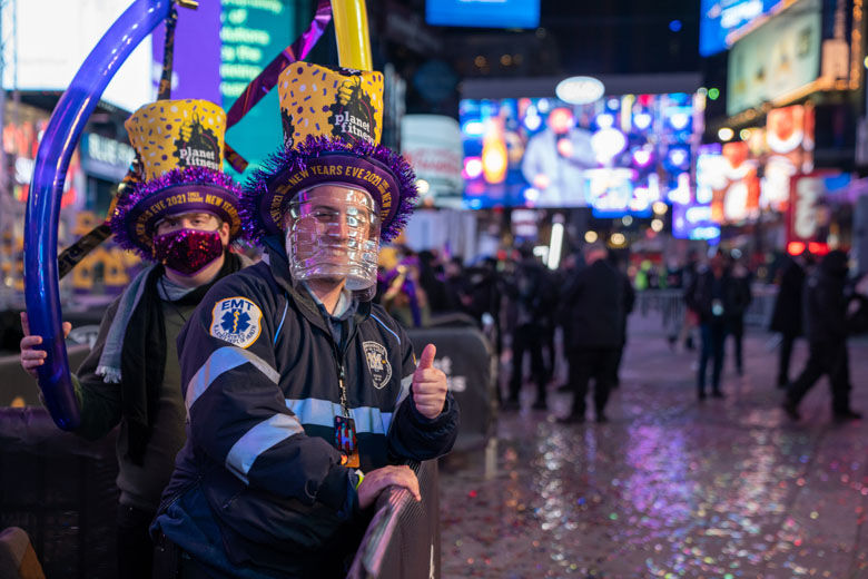 NEW YORK, NY - DECEMBER 31: Revelers celebrate New Years Eve in socially distanced pods at Times Square on December 31, 2020, in New York City. On average, about one million revelers are drawn to the Crossroads of the World to watch performances and celebrate the New Year. This year a limited live audience of about 40 first responders and essential workers will be allowed to watch the New Years' ball drop from a secure area in Times Square. (Photo by David Dee Delgado/Getty Images)