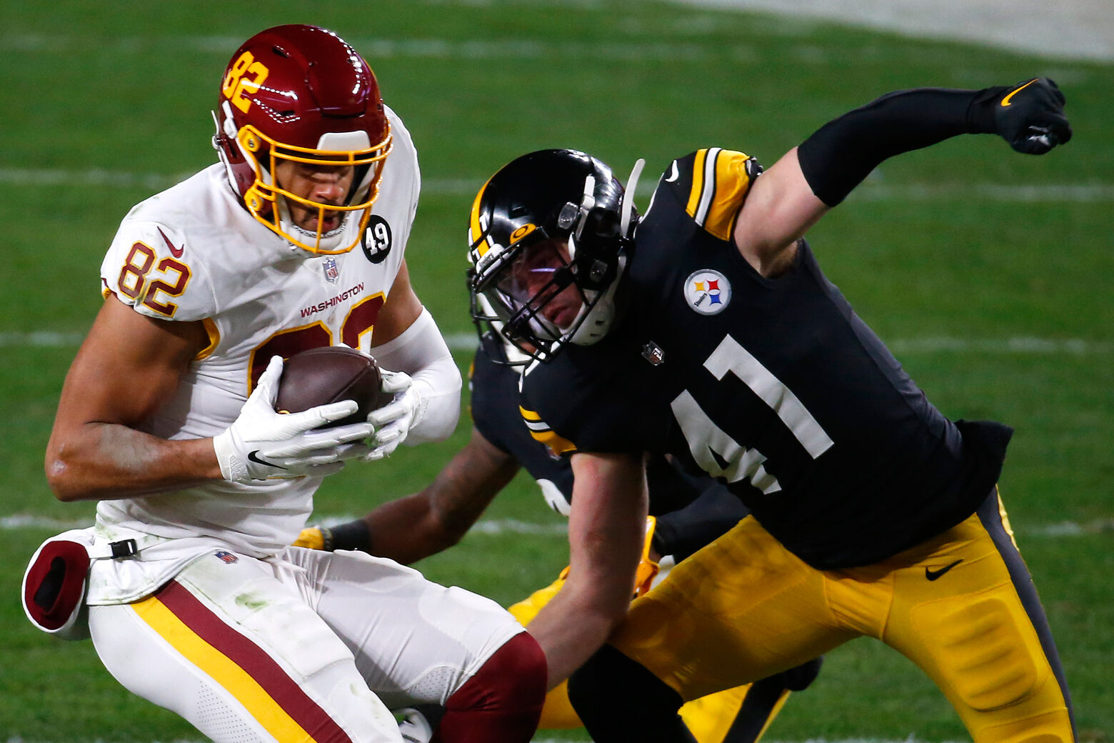 Logan Thomas #82 of the Washington Football Team looks to gain yardage agaisnt Robert Spillane #41 of the Pittsburgh Steelers during the second quarter of their game at Heinz Field on December 07, 2020 in Pittsburgh, Pennsylvania. (Photo by Justin K. Aller/Getty Images)