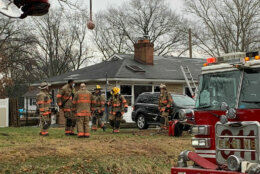 A fire tore though a Prince George's County, Maryland, house on New Year's Day, killing a woman and sending three other people, including an 8-year-old girl, to the hospital with serious injuries. (WTOP/Mike Murillo)