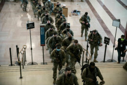 Armed members of a National Guard unit report for duty at the U.S. Capitol building on Jan. 13, 2021. More than 20,000 armed guardsmen are expected to provide security in the nation's capital amid threats against the inauguration of President-elect Joe Biden. (WTOP/Alejandro Alvarez)