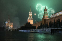 Fireworks explode over the Kremlin and almost empty Red Square during New Year's celebrations in Moscow, Russia, early Friday, Jan. 1, 2021. As the world says goodbye to 2020, there will be countdowns and live performances, but no massed jubilant crowds in traditional gathering spots like the Champs Elysees in Paris and New York City's Times Square this New Year's Eve. (AP Photo/Pavel Golovkin)