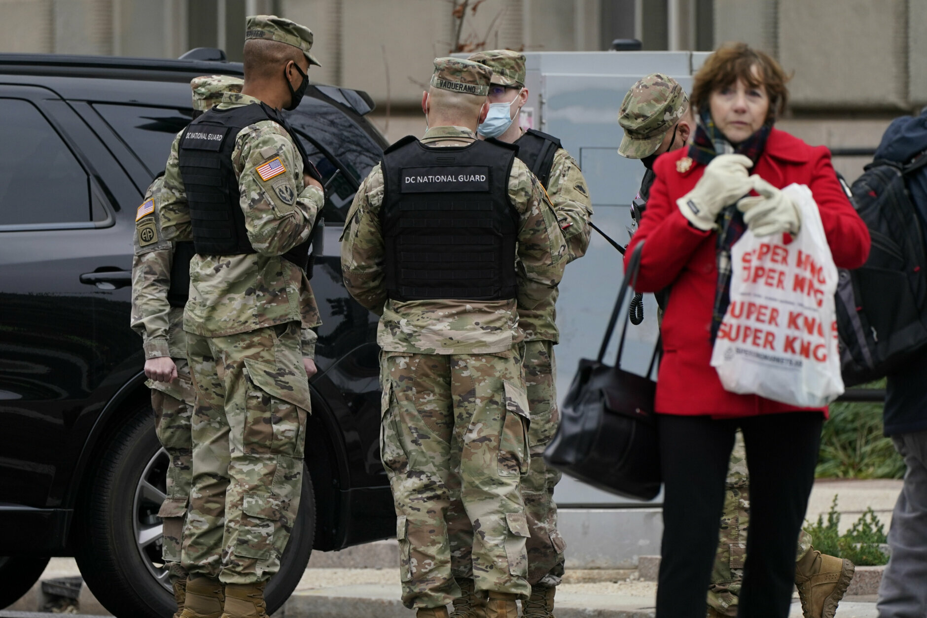 Members of the DC National Guard stand near a rally in Freedom Plaza Tuesday, Jan. 5, 2021, in Washington. Rallies in support of President Donald Trump are planned for Tuesday and Wednesday. (AP Photo/Jacquelyn Martin)
