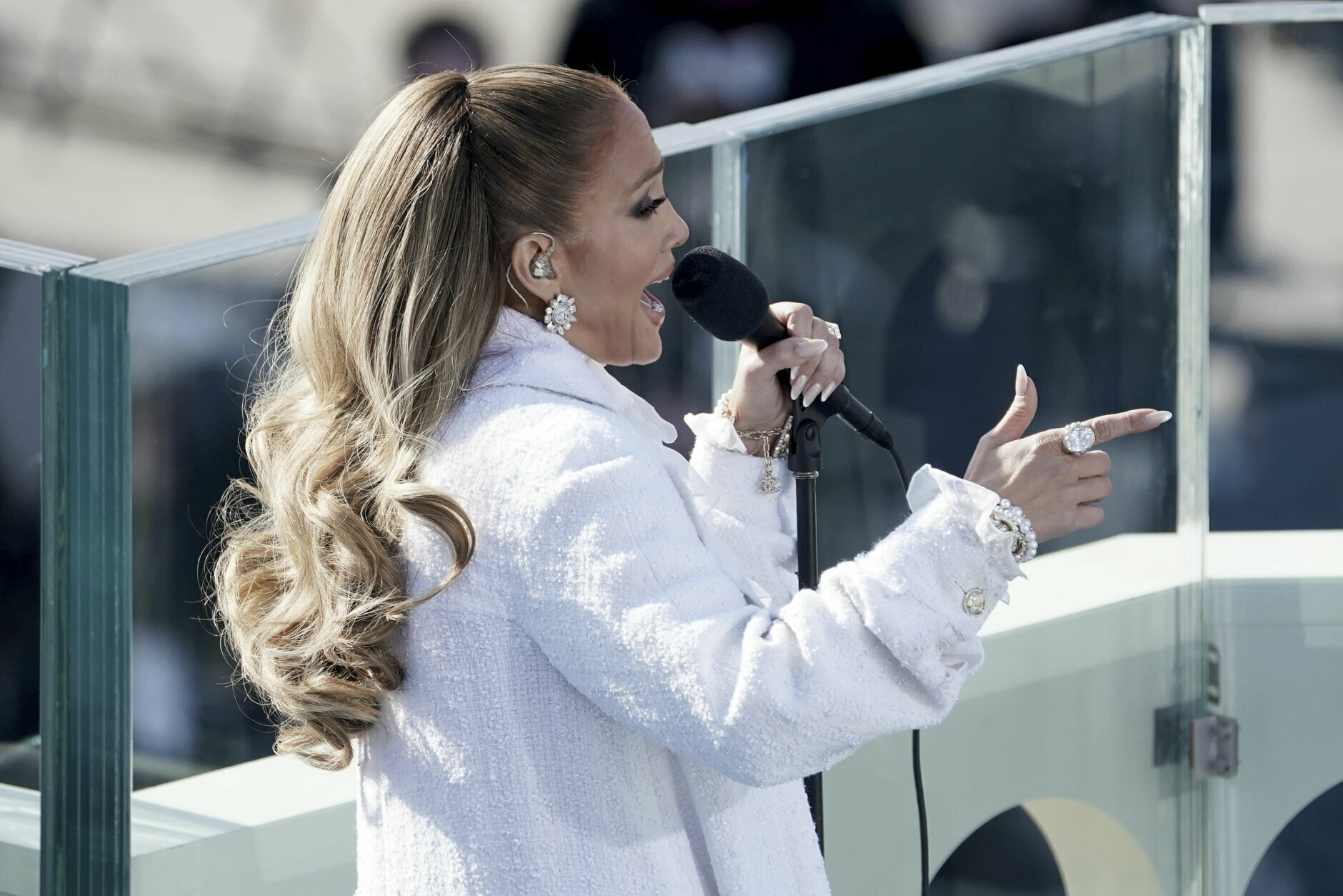 <p>Jennifer Lopez, dressed all in white, delivered a medley of “This Land is Your Land” and “America the Beautiful.”</p>
<blockquote class="twitter-tweet tw-align-center">
<p dir="ltr" lang="en">Let&#8217;s get loud&#8230; for our next president and vice president of the United States!</p>
<p>Thank you <a href="https://twitter.com/JLo?ref_src=twsrc%5Etfw">@JLo</a> for coming and being a part of this historic moment! <a href="https://twitter.com/hashtag/InaugurationDay?src=hash&amp;ref_src=twsrc%5Etfw">#InaugurationDay</a> <a href="https://t.co/nNNtqk7pRC">pic.twitter.com/nNNtqk7pRC</a></p>
<p>— Biden Inaugural Committee (@BidenInaugural) <a href="https://twitter.com/BidenInaugural/status/1351955914887102464?ref_src=twsrc%5Etfw">January 20, 2021</a></p></blockquote>
<p><script async src="https://platform.twitter.com/widgets.js" charset="utf-8"></script></p>
