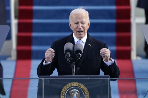 Biden takes the helm, appeals for unity to take on crises