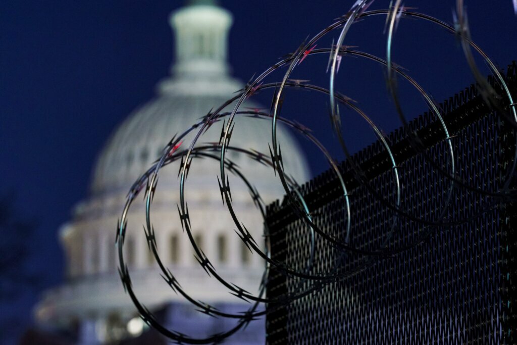 The U.S. Capitol behind a fence.