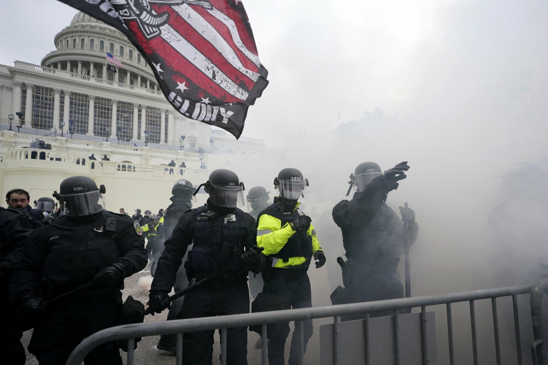 Police hold off Trump supporters who tried to break through a police barrier, Wednesday, Jan. 6, 2021, at the Capitol in Washington. As Congress prepares to affirm President-elect Joe Biden's victory, thousands of people have gathered to show their support for President Donald Trump and his claims of election fraud. (AP Photo/Julio Cortez)