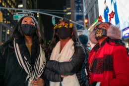 NEW YORK, NY - DECEMBER 31: Revelers arrive to Times Square to get a look at the New Years Eve ball on December 31, 2020, in New York City. The N.Y.P.D. will shut down streets around Times Square to vehicular and pedestrian traffic. This year they will not allow the public near One Times Square to watch the New Years ball drop except for a small group of invited first responders and essential workers because of the COVID-19 pandemic that has claimed over 340,000 lives in the United States. (Photo by David Dee Delgado/Getty Images)