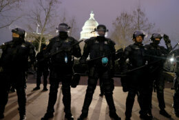 WASHINGTON, DC - JANUARY 06: Police officers in riot gear line up as protesters gather on the U.S. Capitol Building on January 06, 2021 in Washington, DC. Pro-Trump protesters entered the U.S. Capitol building after mass demonstrations in the nation's capital during a joint session Congress to ratify President-elect Joe Biden's 306-232 Electoral College win over President Donald Trump. (Photo by Tasos Katopodis/Getty Images)