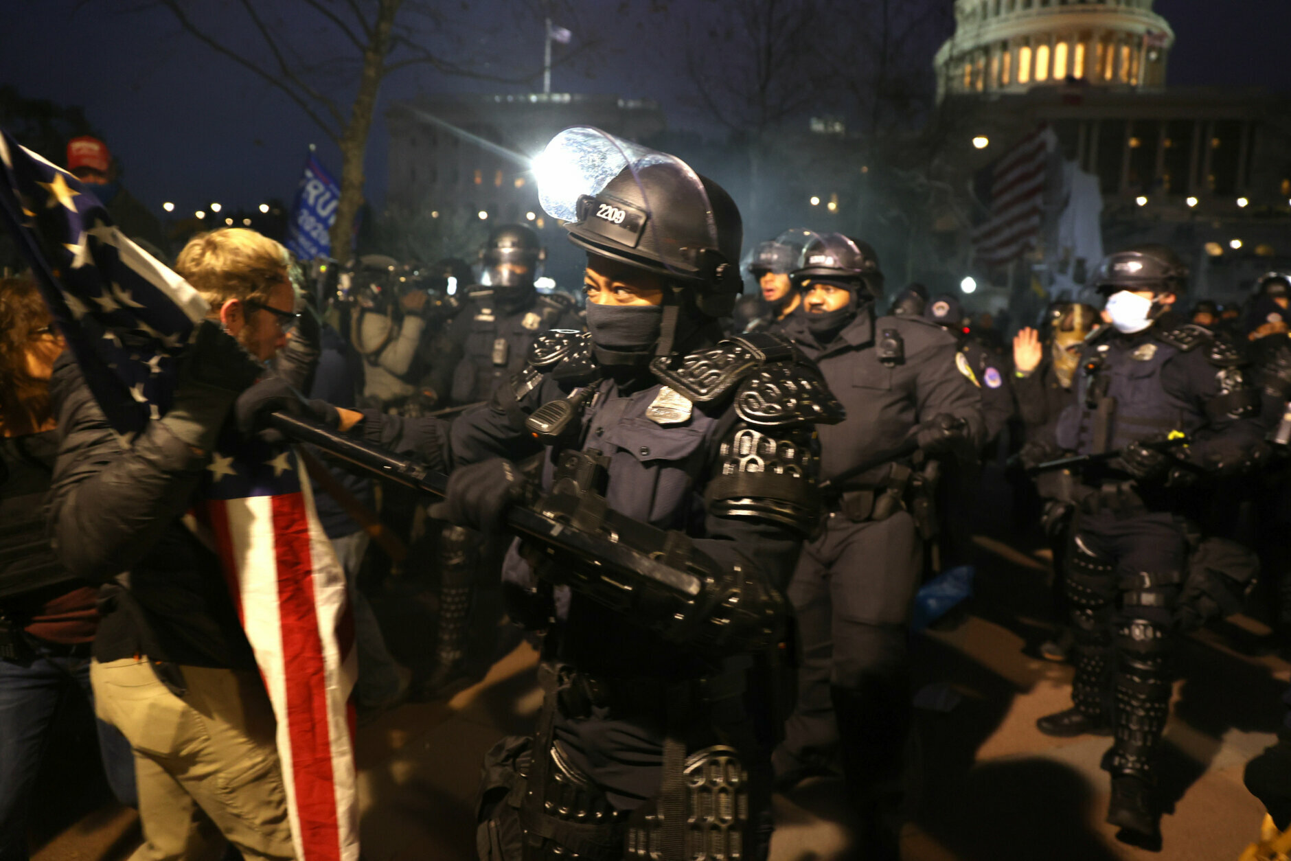 WASHINGTON, DC - JANUARY 06: Police officers in riot gear confront  protesters who are gathering at the U.S. Capitol Building on January 06, 2021 in Washington, DC. Pro-Trump protesters entered the U.S. Capitol building after mass demonstrations in the nation's capital during a joint session Congress to ratify President-elect Joe Biden's 306-232 Electoral College win over President Donald Trump. (Photo by Tasos Katopodis/Getty Images)