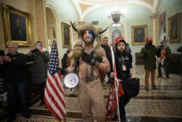 WASHINGTON, DC - JANUARY 06:  A pro-Trump mob confronts U.S. Capitol police outside the Senate chamber of the U.S. Capitol Building on January 06, 2021 in Washington, DC. Congress held a joint session today to ratify President-elect Joe Biden's 306-232 Electoral College win over President Donald Trump. A group of Republican senators said they would reject the Electoral College votes of several states unless Congress appointed a commission to audit the election results. (Photo by Win McNamee/Getty Images)
