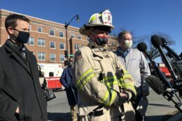 DC Fire Chief John Donnelly (center) addresses the media at the Bridgepoint explosion scene on Jan. 28, 2021. 