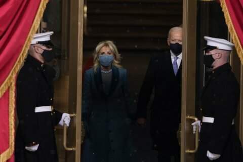 AP PHOTOS: Pandemic, threats of violence taint Biden’s debut
