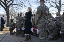 First lady Jill Biden poses for a photograph with members of the National Guard, after surprising them with chocolate chip cookies, Friday, Jan. 22, 2021, at the U.S. Capitol in Washington. (AP Photo/Jacquelyn Martin, Pool)