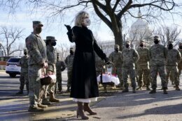 First lady Jill Biden surprises National Guard members outside the Capitol with chocolate chip cookies, Friday, Jan. 22, 2021, in Washington. (AP Photo/Jacquelyn Martin, Pool)