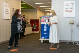 First lady Jill Biden, right, speaks with Kim Thiboldeaux, left, CEO of the Cancer Support Community, during a tour of Whitman-Walker Health, Friday, Jan. 22, 2021, in Washington. (AP Photo/Jacquelyn Martin, Pool)