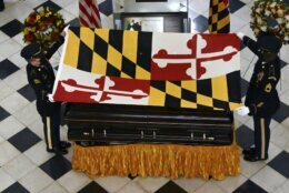 The Maryland National Guard Honor Guard drapes the Maryland flag on the casket of Maryland Senate President Emeritus Thomas V. Mike Miller under the dome of the State House in Annapolis, Md., Thursday, Jan. 21, 2021. (Kim Hairston/The Baltimore Sun via AP, Pool)