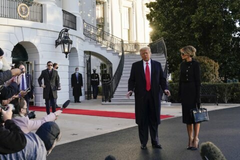 Trump bids farewell to Washington, hints of comeback