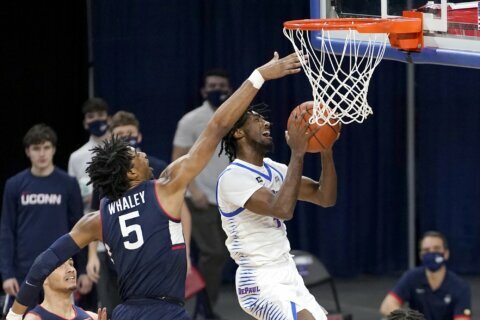 McGhee scores 27 to lead Liberty over East Carolina 74-64