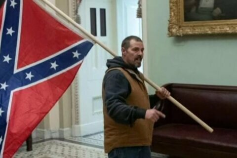 Man seen holding Confederate flag in Capitol riot arrested
