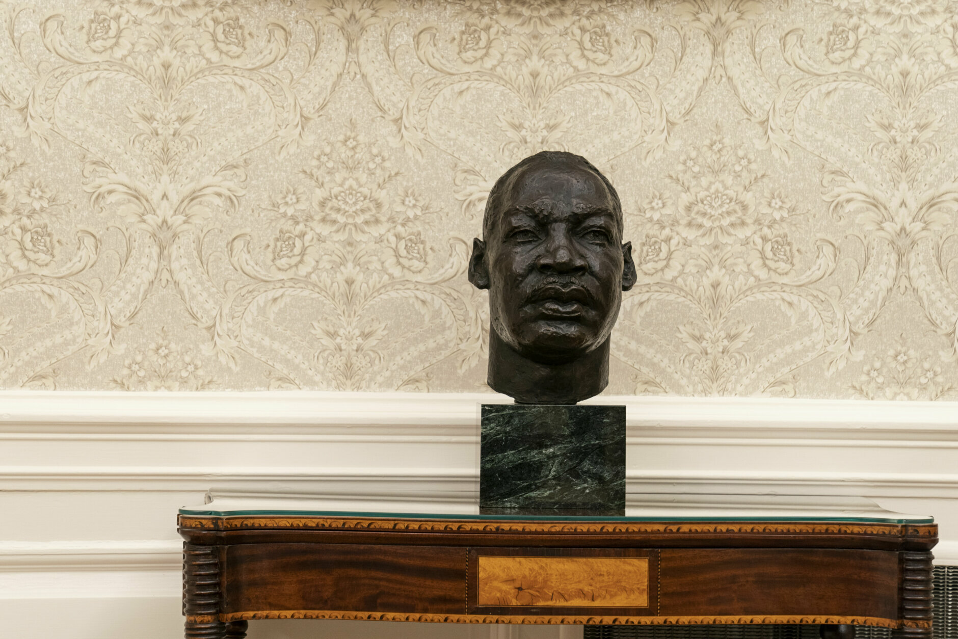 The Oval Office of the White House is newly redecorated for the first day of President Joe Biden's administration, Wednesday, Jan. 20, 2021, in Washington, including a bust of civil rights leader Rev. Martin Luther King Jr.. (AP Photo/Alex Brandon)