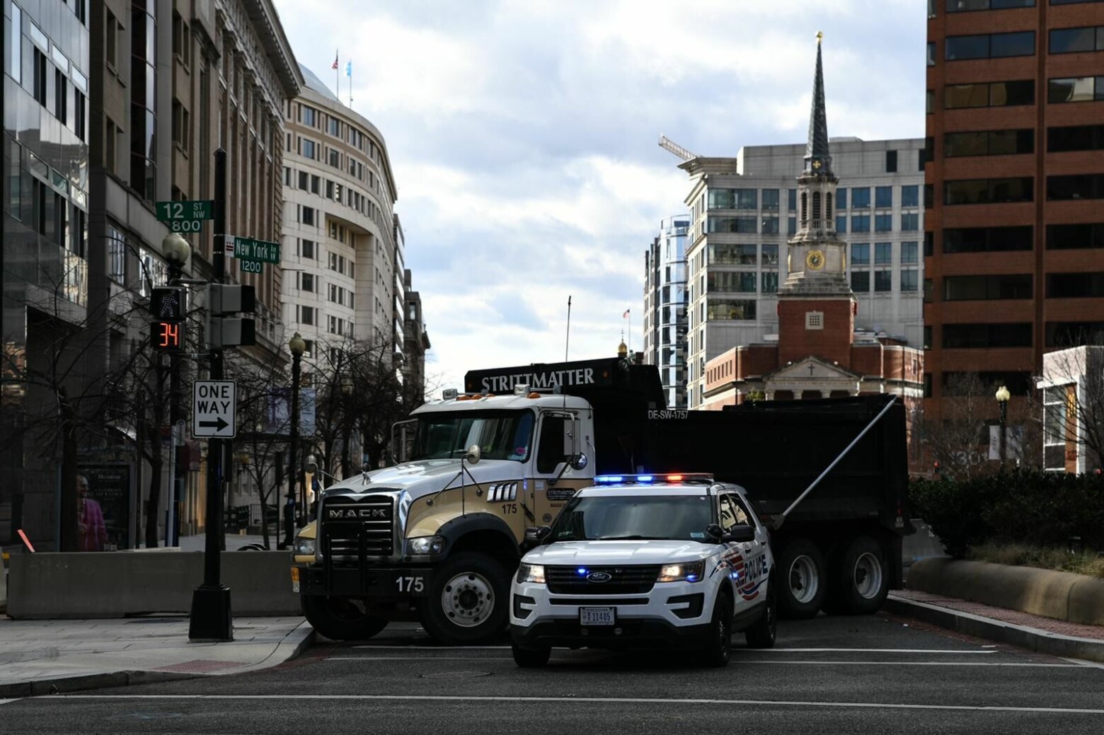 <p>Police cars team up with Mack trucks to block some D.C. streets.</p>
