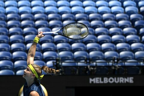 Australian Open goes quiet as lockdown keeps crowds away