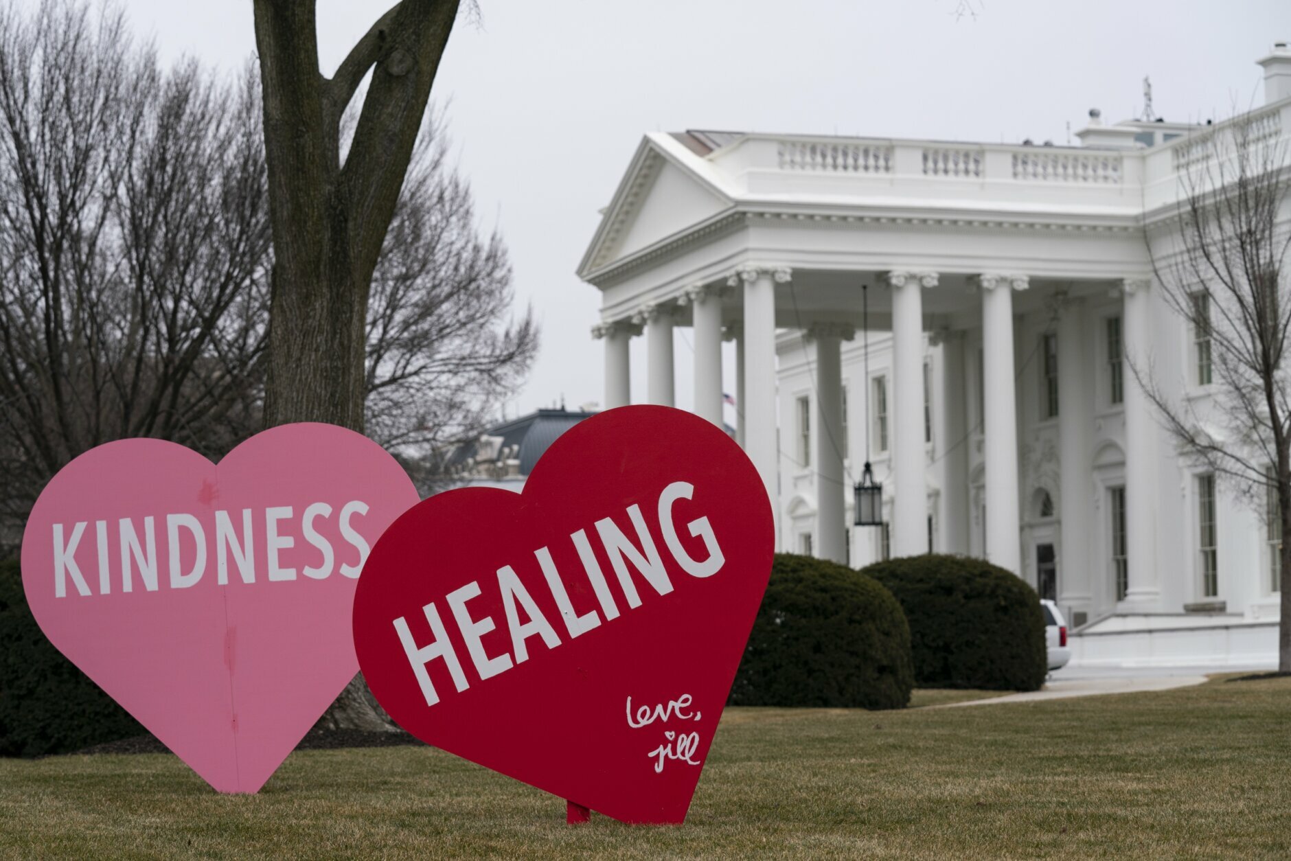 A Valentine's Day decoration, signed by first lady Jill Biden, sits on the North Lawn of the White House, Friday, Feb. 12, 2021, in Washington. (AP Photo/Evan Vucci)