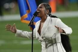 Jazmine Sullivan performs with Eric Church during the national anthem before the NFL Super Bowl 55 football game between the Kansas City Chiefs and Tampa Bay Buccaneers, Sunday, Feb. 7, 2021, in Tampa, Fla. (AP Photo/David J. Phillip)