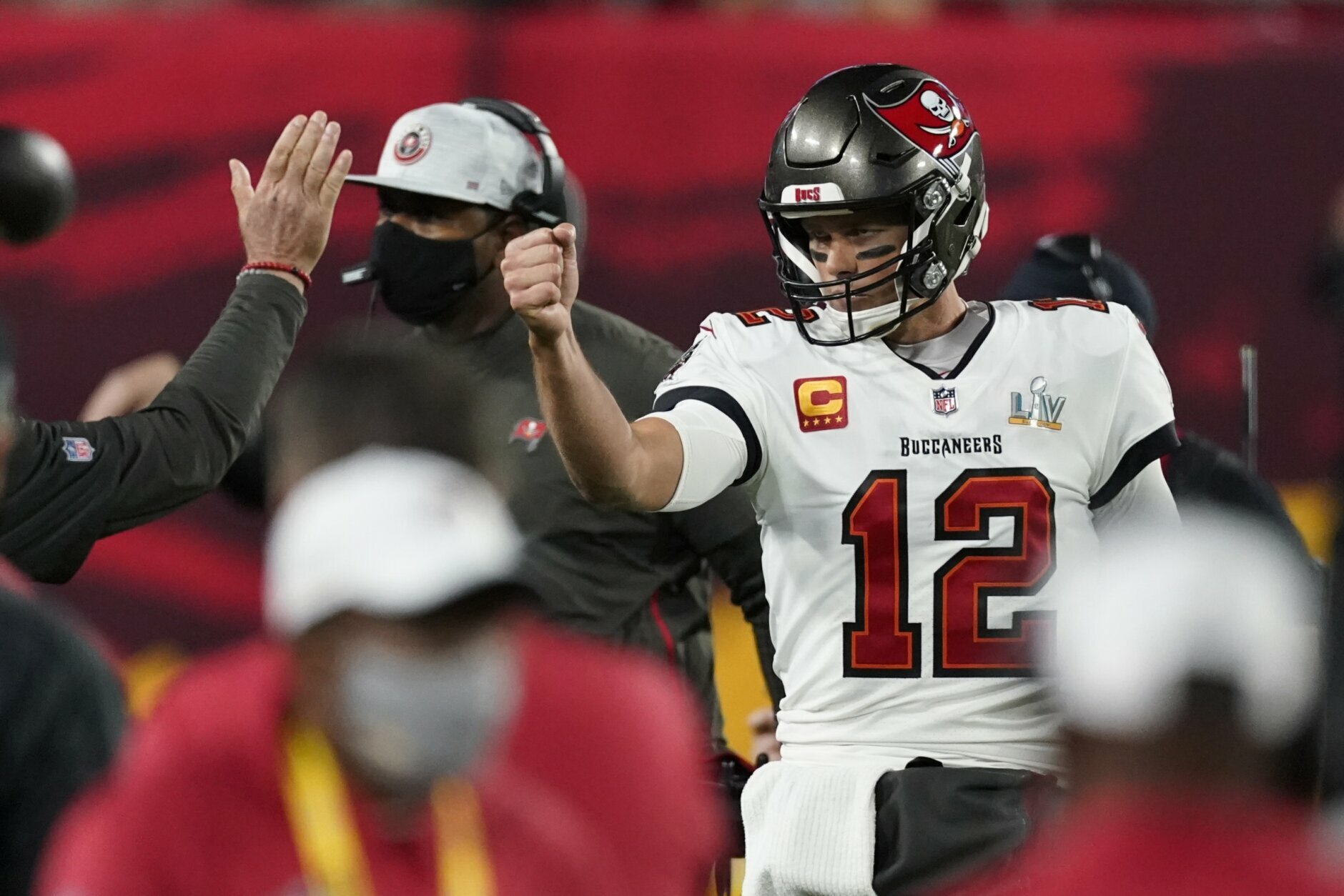 Tampa Bay Buccaneers quarterback Tom Brady celebrates after his team scored a touchdown against the Kansas City Chiefs during the first half of the NFL Super Bowl 55 football game Sunday, Feb. 7, 2021, in Tampa, Fla. (AP Photo/Ashley Landis)