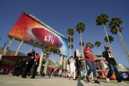 Fans arrive before the NFL Super Bowl 55 football game between the Kansas City Chiefs and Tampa Bay Buccaneers, Sunday, Feb. 7, 2021, in Tampa, Fla. (AP Photo/Mark Humphrey)