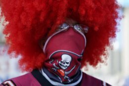 A Tampa Bay Buccaneers fan arrives before the NFL Super Bowl 55 football game between the Kansas City Chiefs and Tampa Bay Buccaneers, Sunday, Feb. 7, 2021, in Tampa, Fla. (AP Photo/Mark Humphrey)