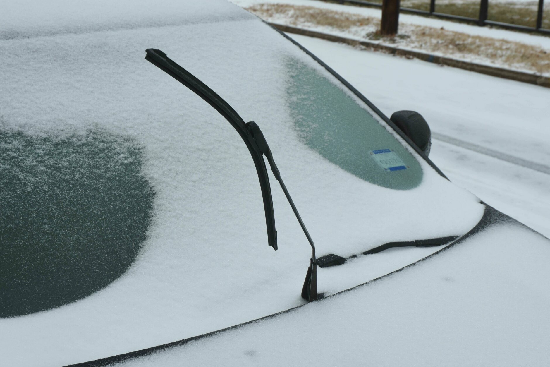 Cars were coated under a sheet of snow and ice after a winter storm in the D.C. area on Feb. 18, 2021. 