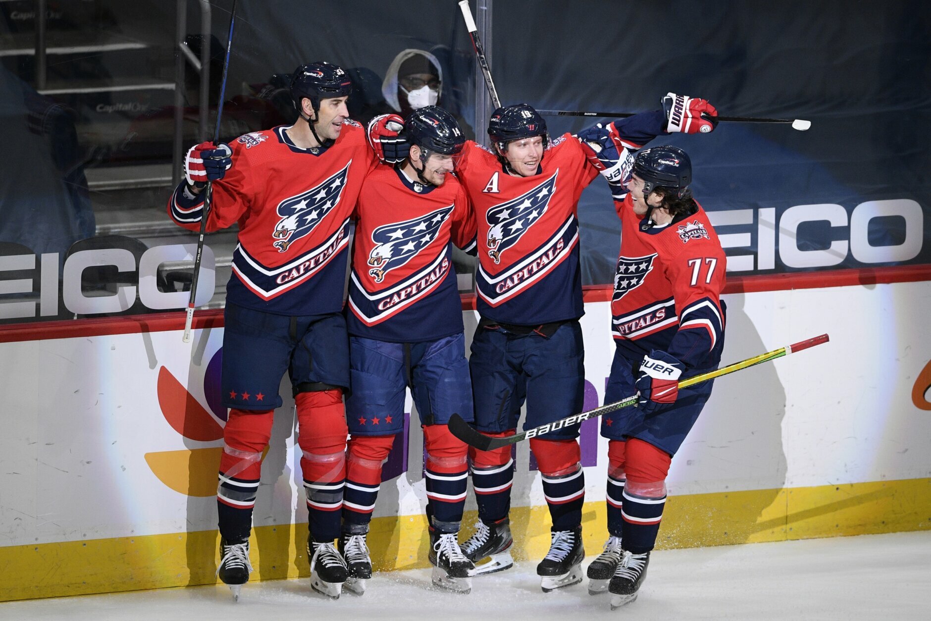 Washington Capitals right wing Richard Panik, second from the left, celebrates his goal with defenseman Zdeno Chara (33), center Nicklas Backstrom (19) and right wing T.J. Oshie (77) during the second period of an NHL hockey game against the Pittsburgh Penguins, Tuesday, Feb. 23, 2021, in Washington. (AP Photo/Nick Wass)