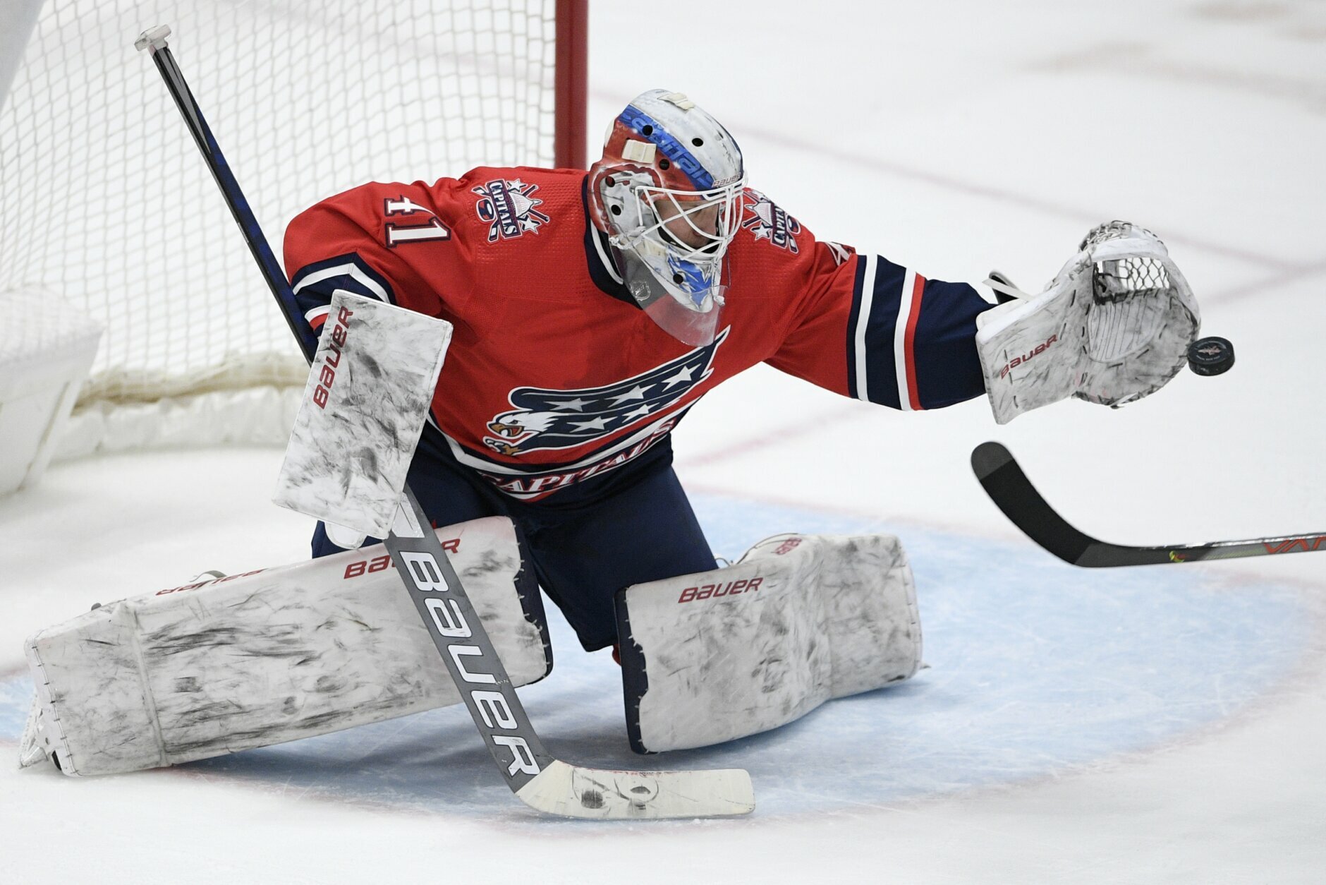 Washington Capitals goaltender Vitek Vanecek (41) reaches to catch the puck during the second period of an NHL hockey game against the Pittsburgh Penguins, Tuesday, Feb. 23, 2021, in Washington. (AP Photo/Nick Wass)
