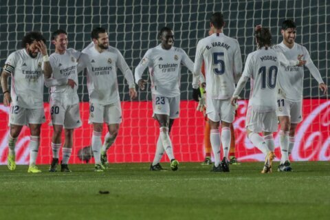 Depleted Madrid wins postponed game, gets closer to Atlético