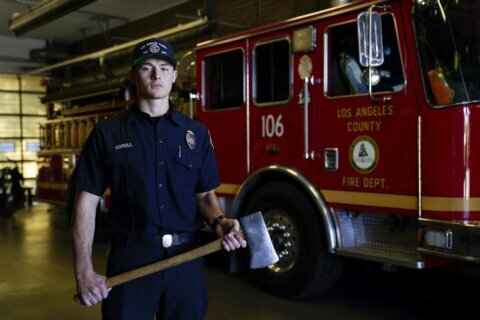 LA firefighters rely on ax, luck to free Woods from crash