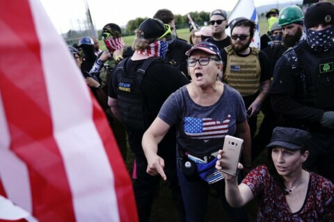 Woman charged in Capitol melee says Proud Boys recruited her