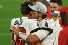 TAMPA, FLORIDA - FEBRUARY 07: Blaine Gabbert #11 of the Tampa Bay Buccaneers hugs Tom Brady #12 during the fourth quarter against the Kansas City Chiefs in Super Bowl LV at Raymond James Stadium on February 07, 2021 in Tampa, Florida. (Photo by Mike Ehrmann/Getty Images)