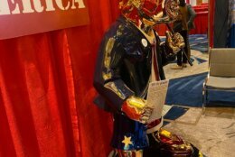 A golden Trump statue is displayed at the 2021 Conservative Political Action Conference.