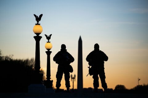 Nearly 5,000 National Guard troops to remain in Washington through mid-March due to concerns about QAnon chatter