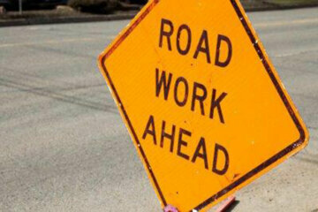 "Roadwork aead" sign