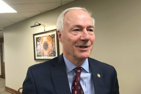Arkansas governor signs near-total abortion ban into law
