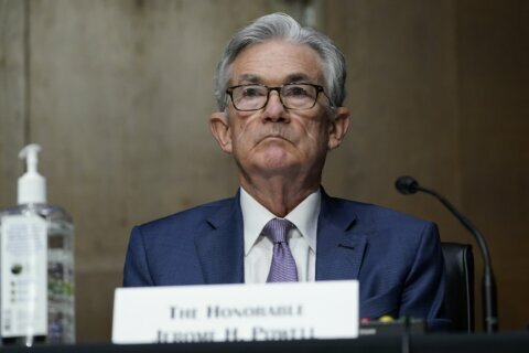 Fed expects to keep its key rate near zero through 2023