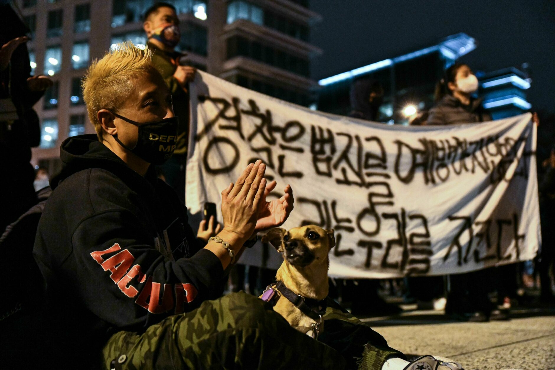DC activists protest in response to Atlanta-based mass shooting. (Alejandro Alvarez / WTOP) 